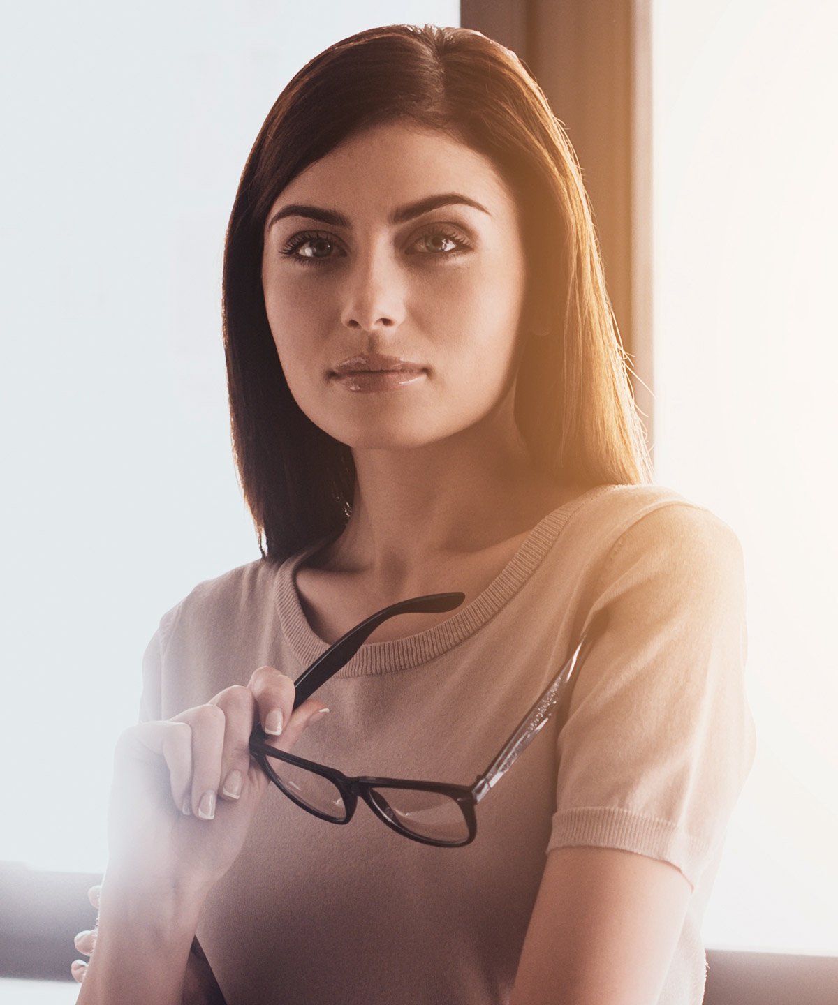 fat transfer patient holding glasses